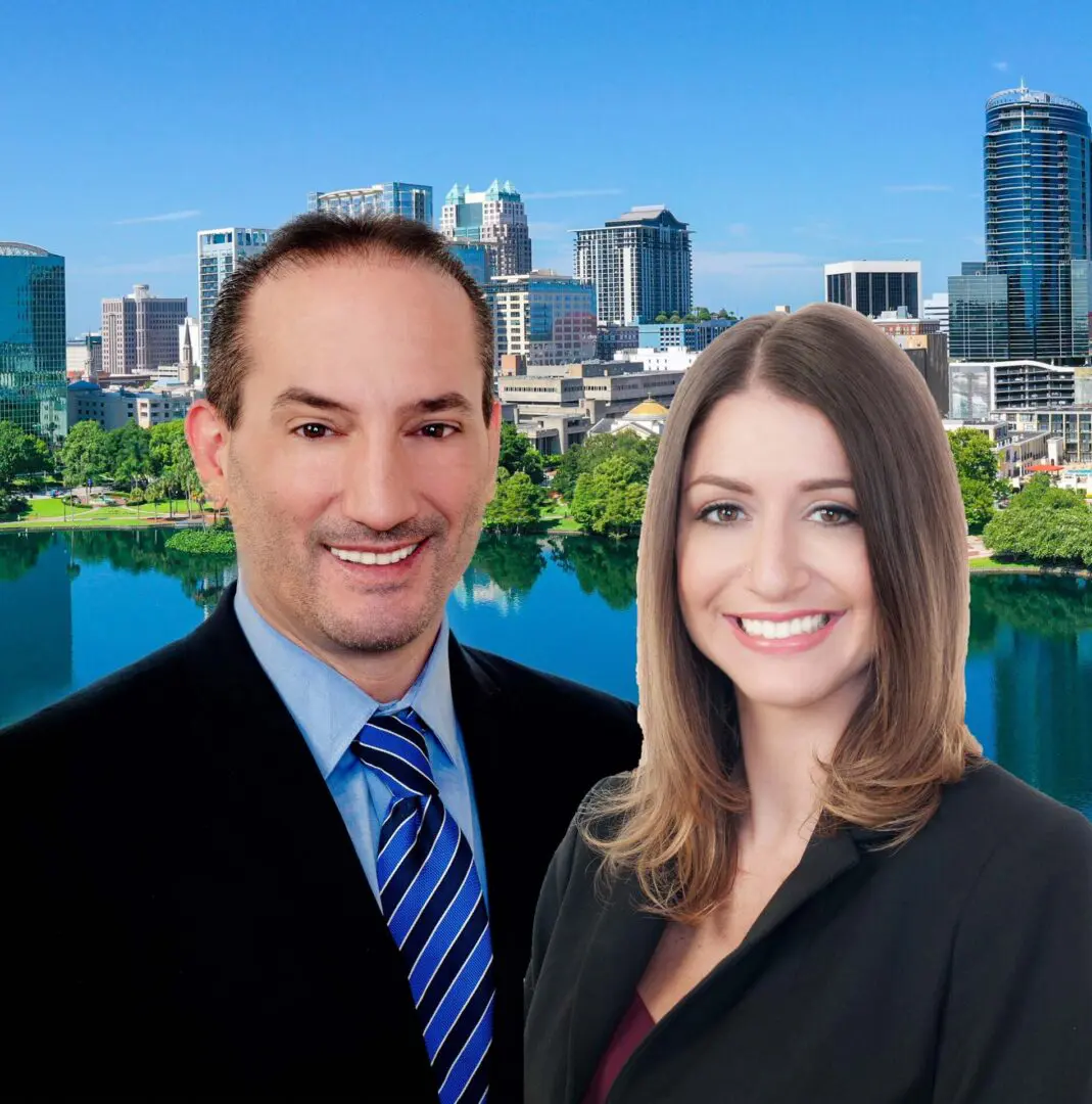 A man and woman standing in front of a city skyline.